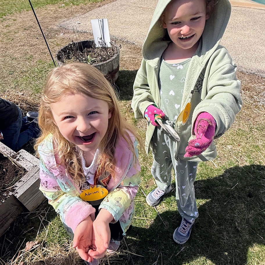 Student holds a worm